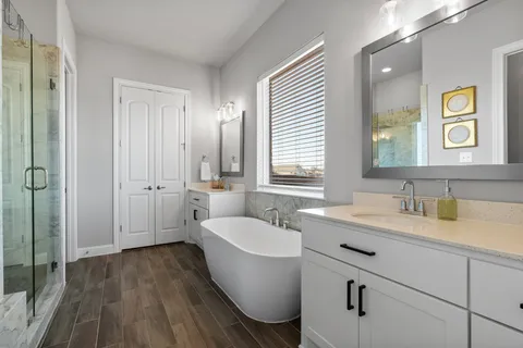 a bathroom with a sink a toilet and mirror
