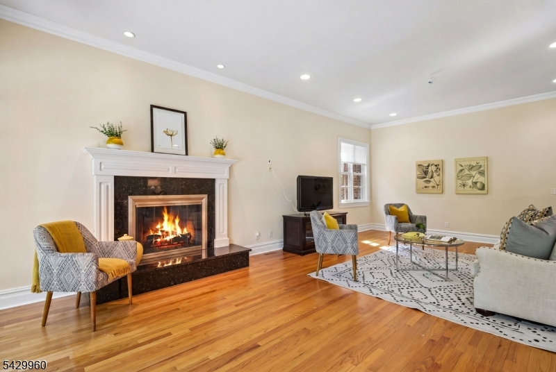 6 Grosvenor Road Short Hills, NJ 07078 - Photo 12 of 50 a living room with furniture and a fireplace