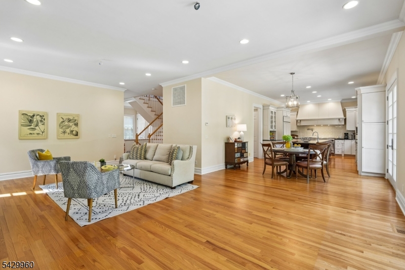 6 Grosvenor Road Short Hills, NJ 07078 - Photo 14 of 50 a living room with furniture and kitchen view with wooden floor