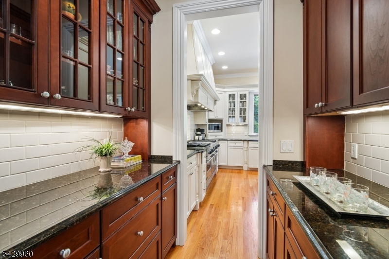6 Grosvenor Road Short Hills, NJ 07078 - Photo 20 of 50 a kitchen with a sink stove and cabinets