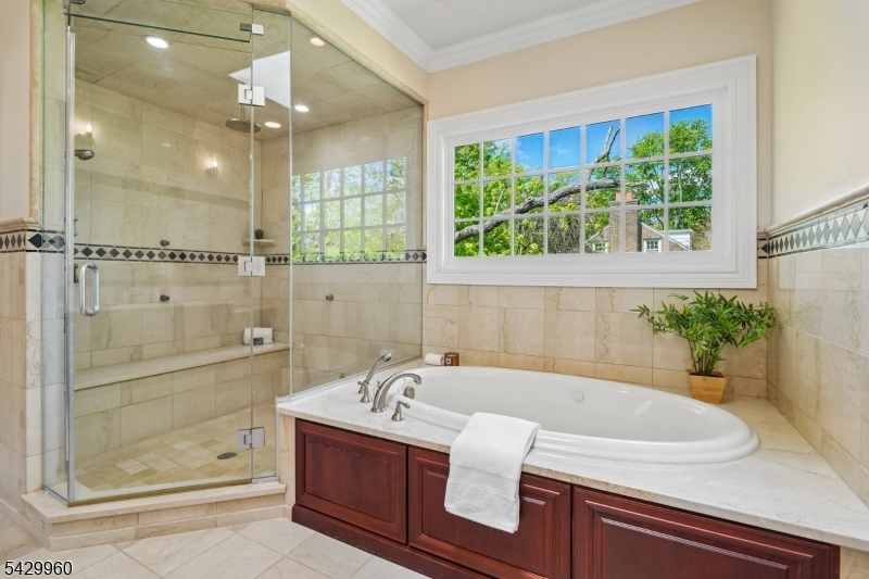 6 Grosvenor Road Short Hills, NJ 07078 - Photo 25 of 50 a bath tub sitting in a bathroom next to a window
