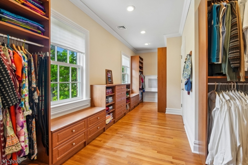 6 Grosvenor Road Short Hills, NJ 07078 - Photo 29 of 50 a spacious bedroom with a large window and a rug