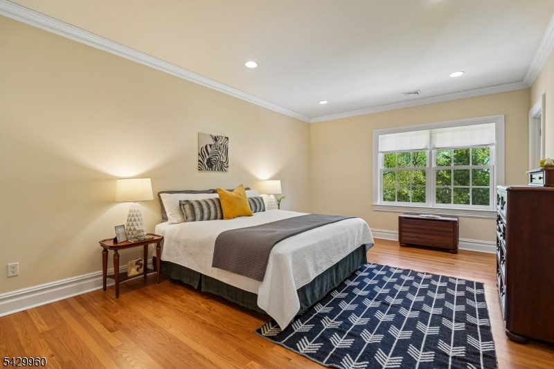 6 Grosvenor Road Short Hills, NJ 07078 - Photo 32 of 50 a bedroom with a bed and a couch