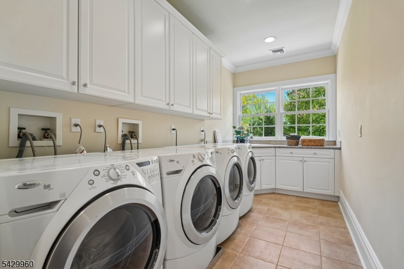 6 Grosvenor Road Short Hills, NJ 07078 - Photo 36 of 50 a utility room with sink dryer and washer