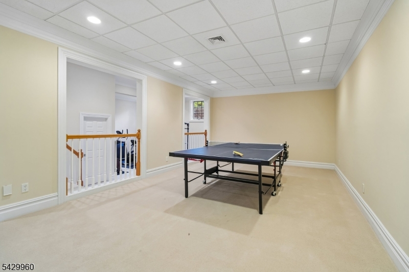 6 Grosvenor Road Short Hills, NJ 07078 - Photo 41 of 50 a view of a big room with wooden floor and furniture