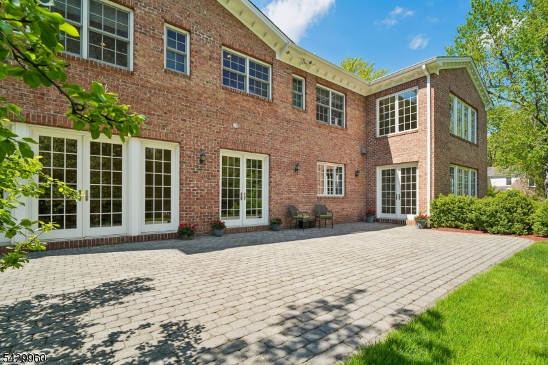 6 Grosvenor Road Short Hills, NJ 07078 - Photo 43 of 50 a front view of a house with a yard