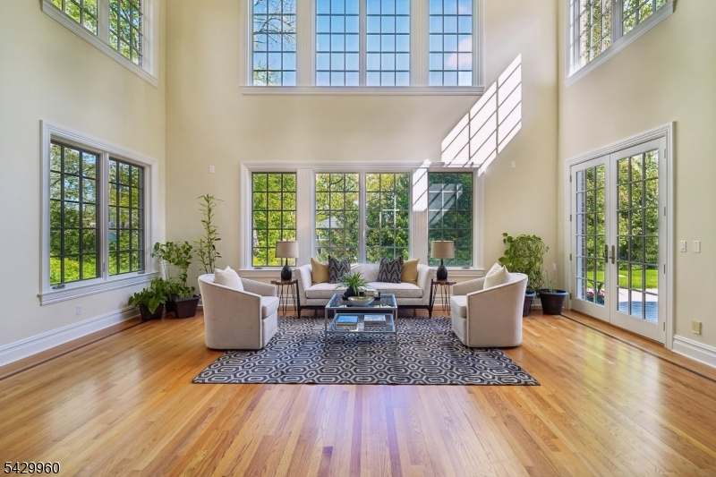 6 Grosvenor Road Short Hills, NJ 07078 - Photo 7 of 50 a living room with furniture and large windows
