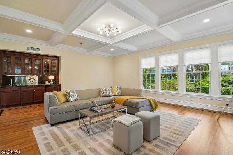 6 Grosvenor Road Short Hills, NJ 07078 - Photo 9 of 50 a living room with furniture and a large window