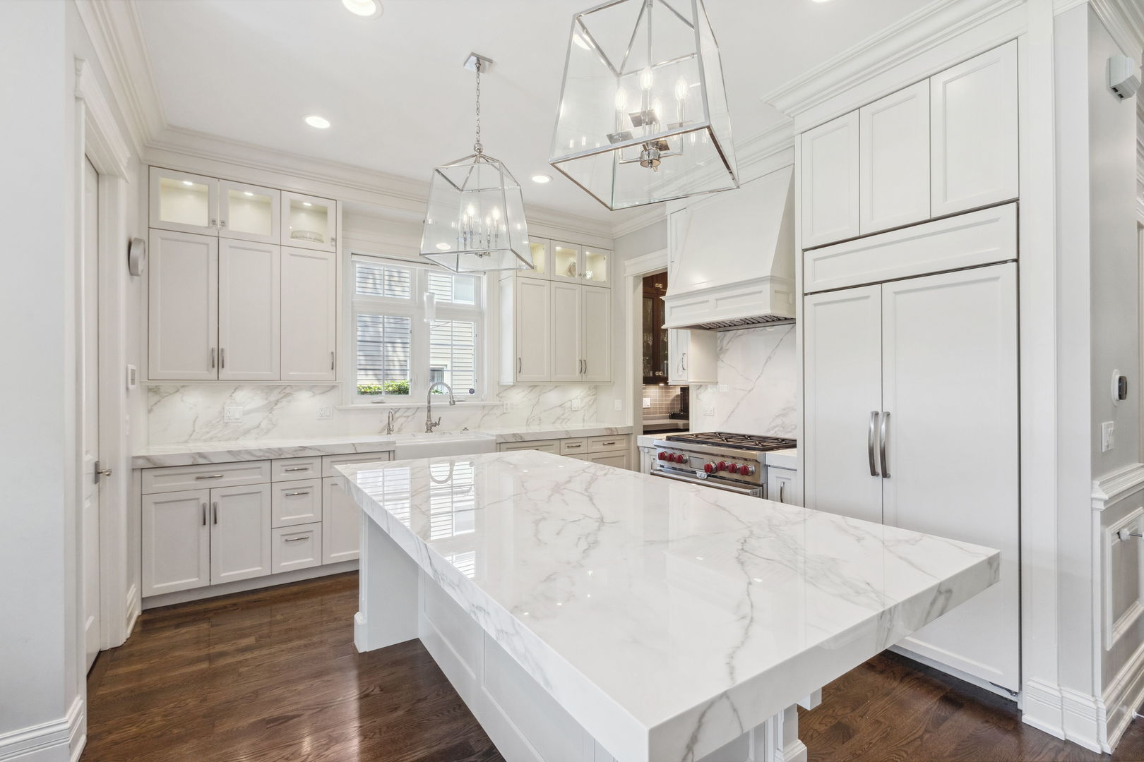 923 Harvard Lane Wilmette, IL 60091 - Photo 12 of 42 a kitchen with stainless steel appliances granite countertop a sink a stove and a refrigerator