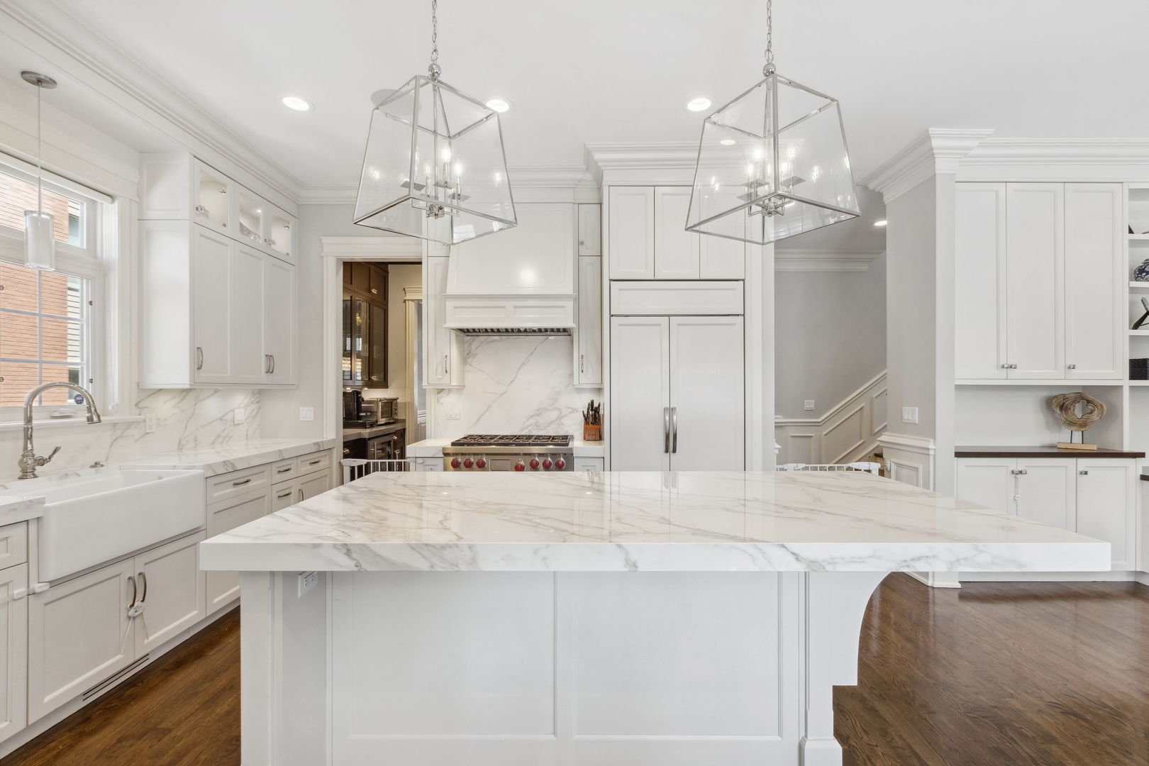923 Harvard Lane Wilmette, IL 60091 - Photo 13 of 42 a large kitchen with kitchen island a sink stainless steel appliances and a chandelier