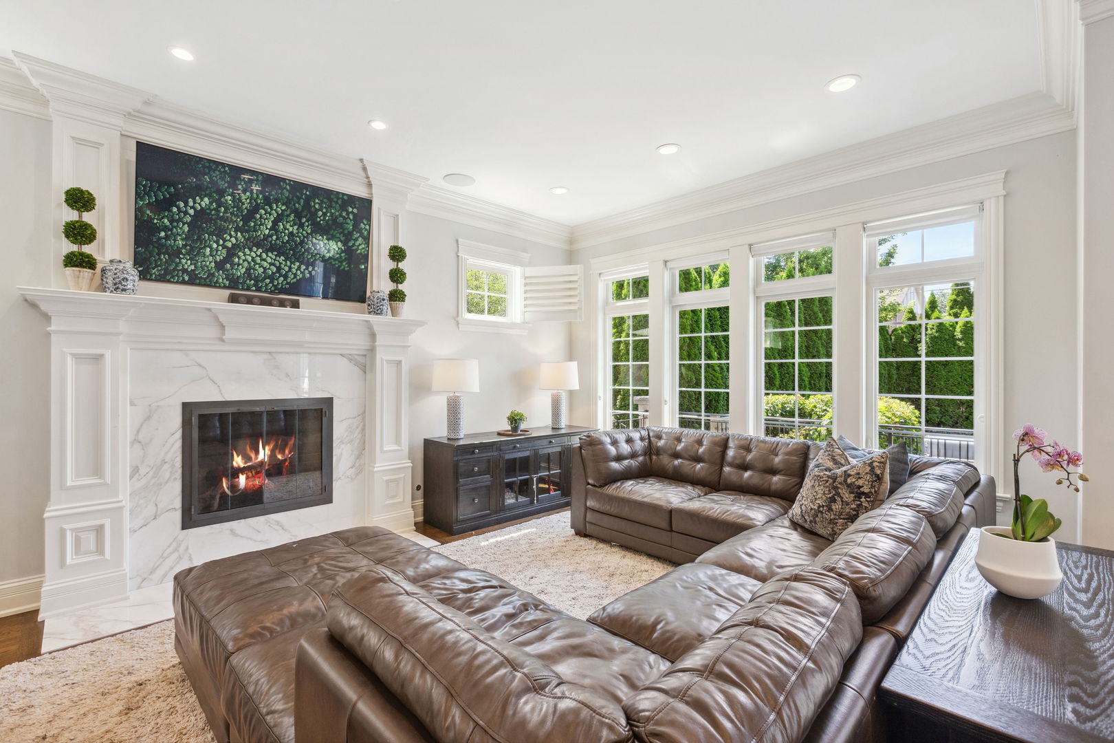 923 Harvard Lane Wilmette, IL 60091 - Photo 16 of 42 a living room with furniture a large window and a fireplace