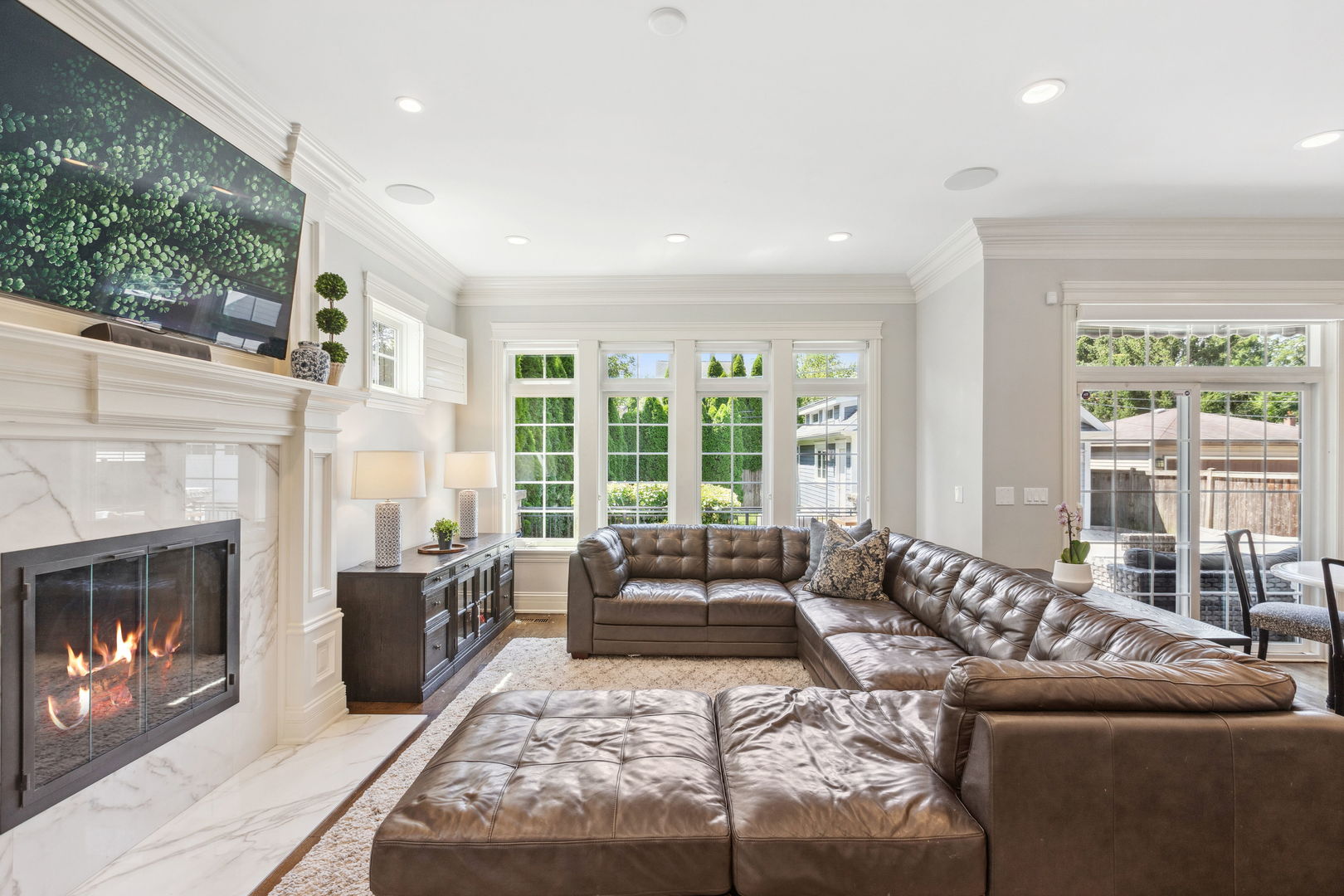 923 Harvard Lane Wilmette, IL 60091 - Photo 17 of 42 a living room with furniture large window and a fireplace