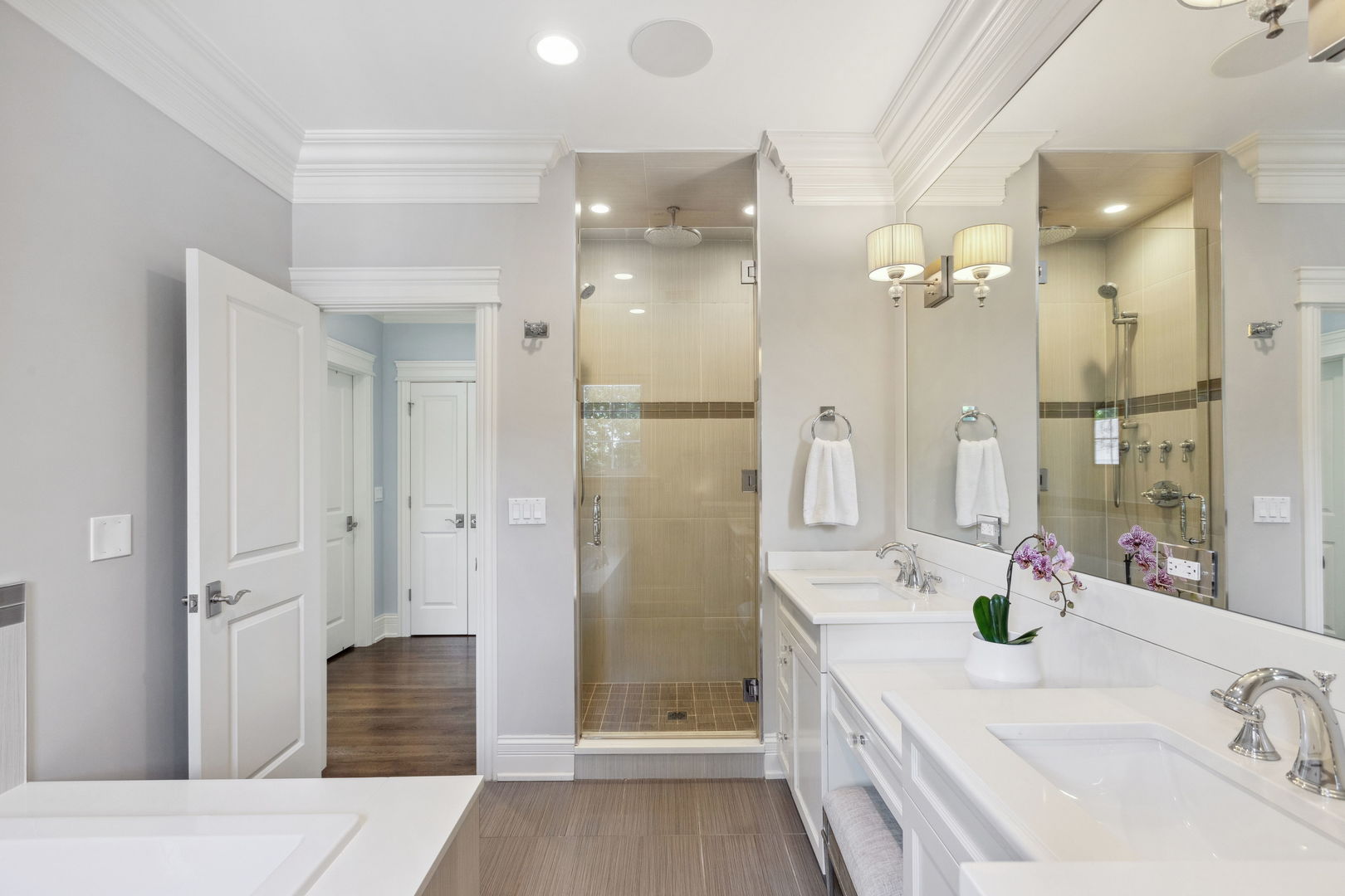 923 Harvard Lane Wilmette, IL 60091 - Photo 21 of 42 a bathroom with a double vanity sink a large mirror a shower and vanity