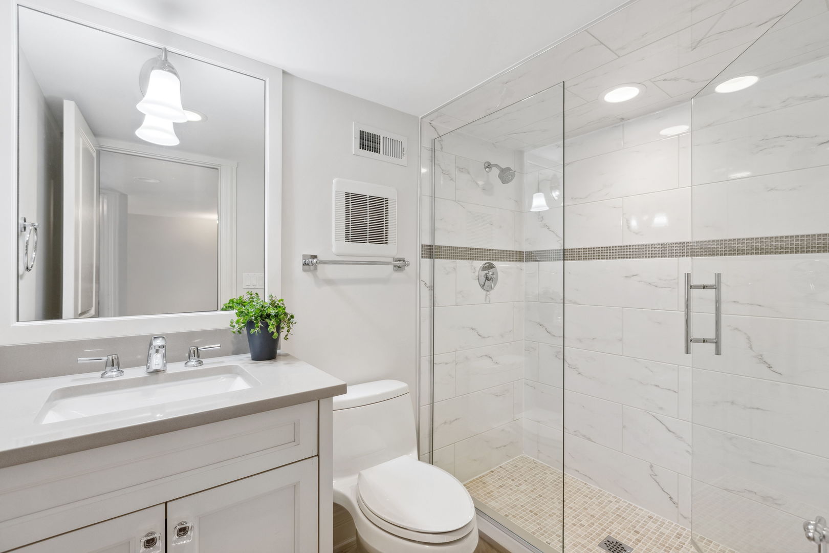 923 Harvard Lane Wilmette, IL 60091 - Photo 23 of 42 a bathroom with a sink a toilet and shower