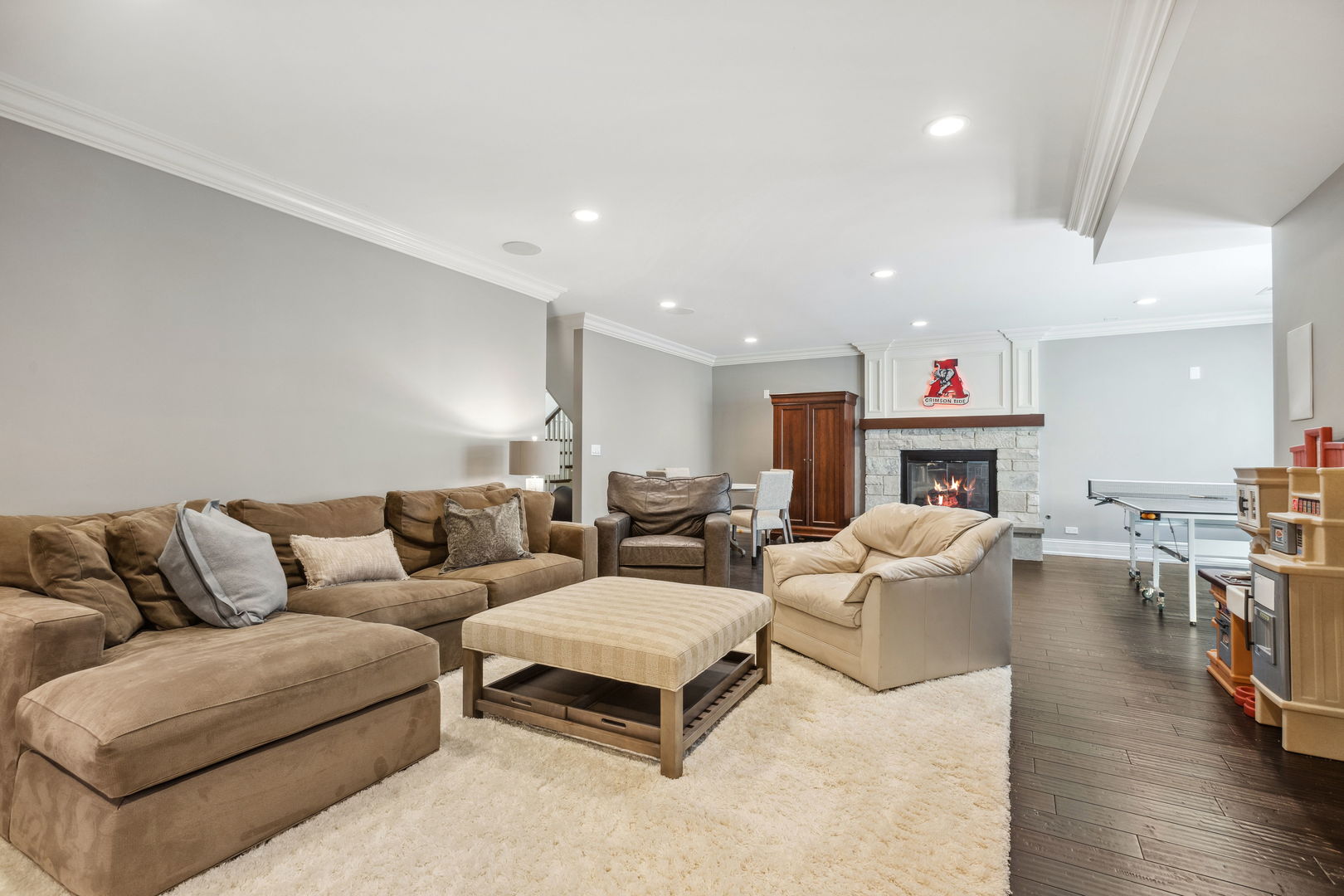923 Harvard Lane Wilmette, IL 60091 - Photo 33 of 42 a living room with furniture a fireplace and a dining table with wooden floor