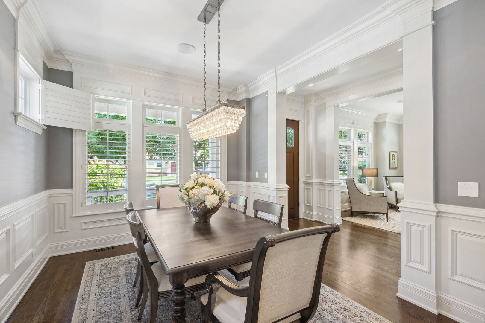 923 Harvard Lane Wilmette, IL 60091 - Photo 7 of 42 a view of a dining room with furniture window and wooden floor