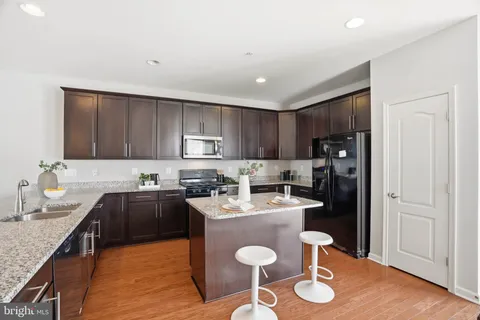 a kitchen with a sink a stove and refrigerator