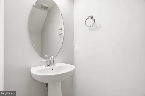 a bathroom with a sink and mirror