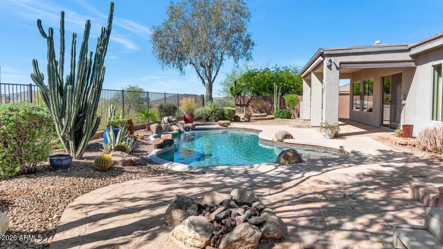 41123 North River Bend Road Phoenix, AZ 85086 - Photo 25 of 45 a view of a house with backyard and sitting area