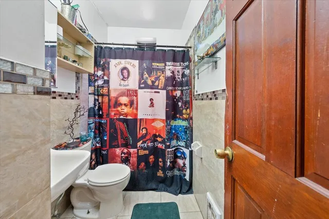 a view of a room with rack on the wall and window