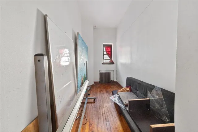 a view of building with yard and bench