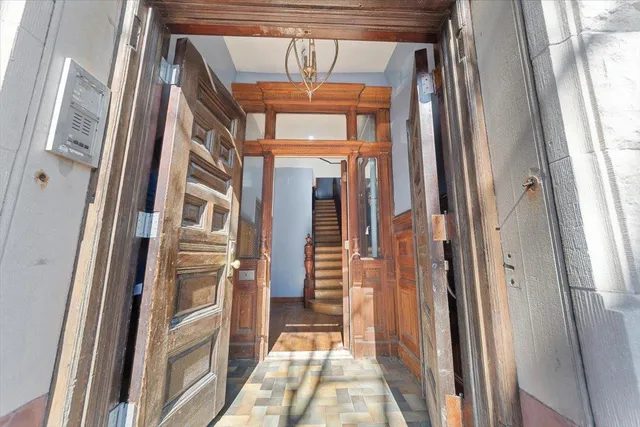 a view of an entryway with a floor to ceiling window