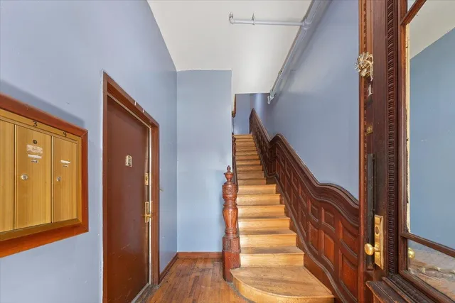 a view of staircase with wooden floor and stairs