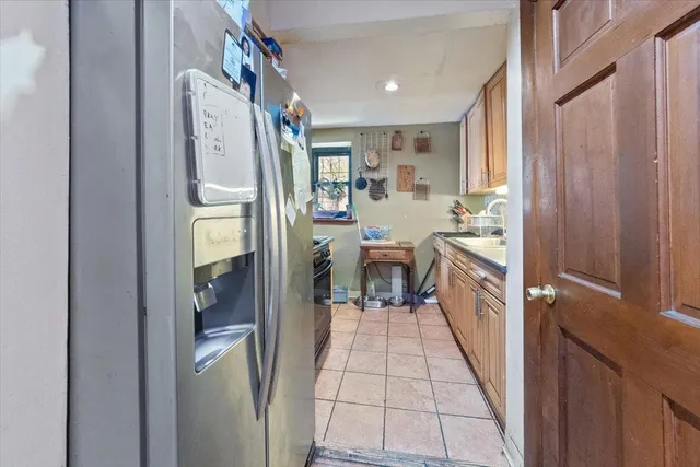 a kitchen with stainless steel appliances a stove a sink and a refrigerator