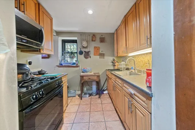 a bathroom with a sink toilet and mirror