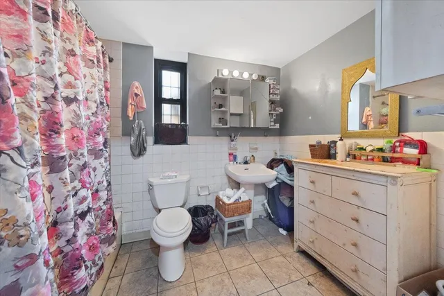 a bed room with a bed and a desk