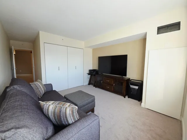 a kitchen with kitchen island a sink stove and microwave