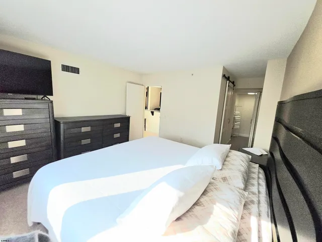 a bathroom with a toilet a sink and shower