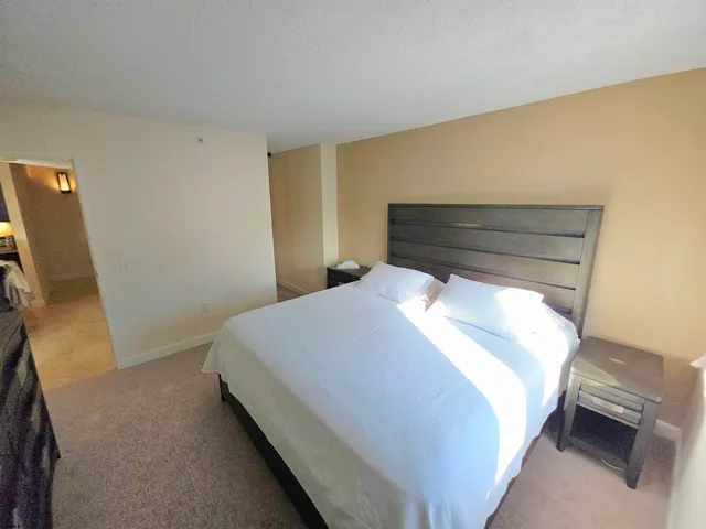 a bathroom with a toilet sink vanity and mirror