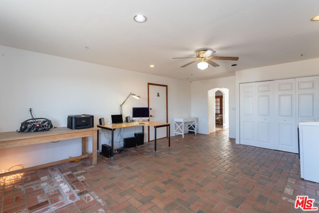 29243 Piani Road Pearblossom, CA 93553 - Photo 24 of 64 a view of a workspace with furniture