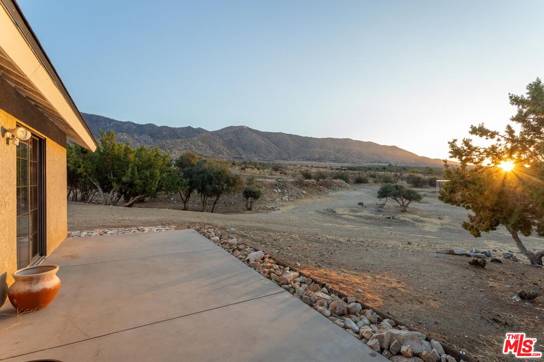 29243 Piani Road Pearblossom, CA 93553 - Photo 31 of 64 a view of a road with a barn in the background