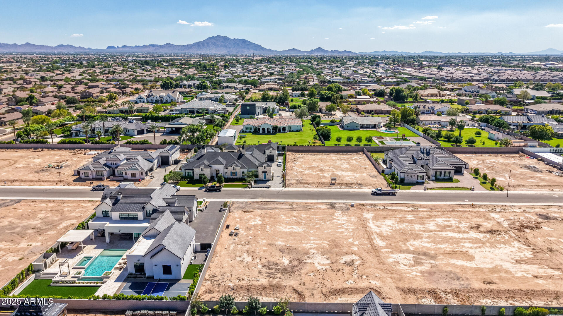 2714 East Blue Sage Road, Unit 128 Gilbert, AZ 85297 - Photo 9 of 18 an aerial view of residential houses with outdoor space and parking