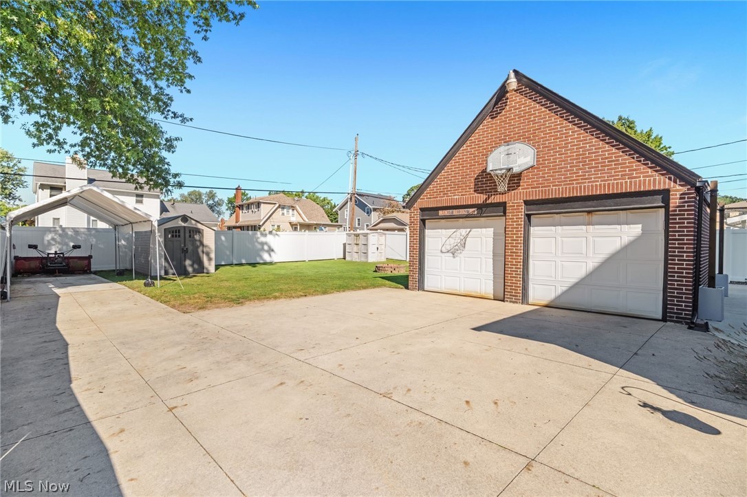 221 Raff Road Northwest Canton, OH 44708 - Photo 28 of 31 Brick two-car detached garage with panel garage doors