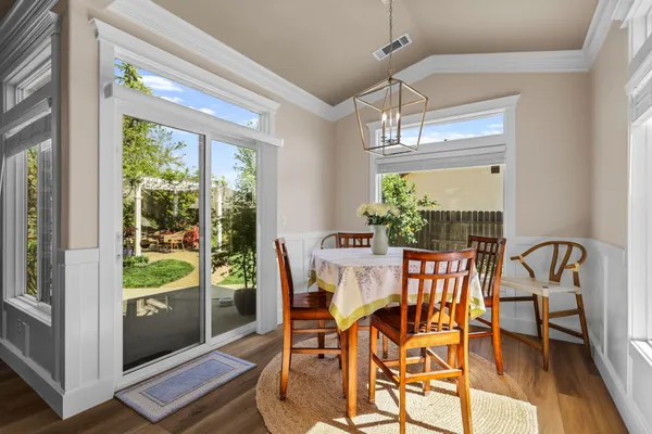 a bedroom with furniture and a large window