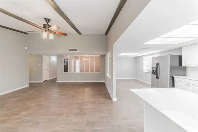 a view of a kitchen and a window