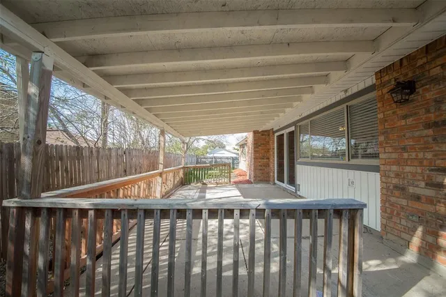 a view of balcony with wooden floor