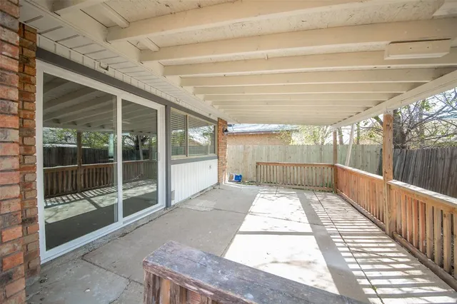 a view interior of the house with a floor to ceiling window and wooden fence