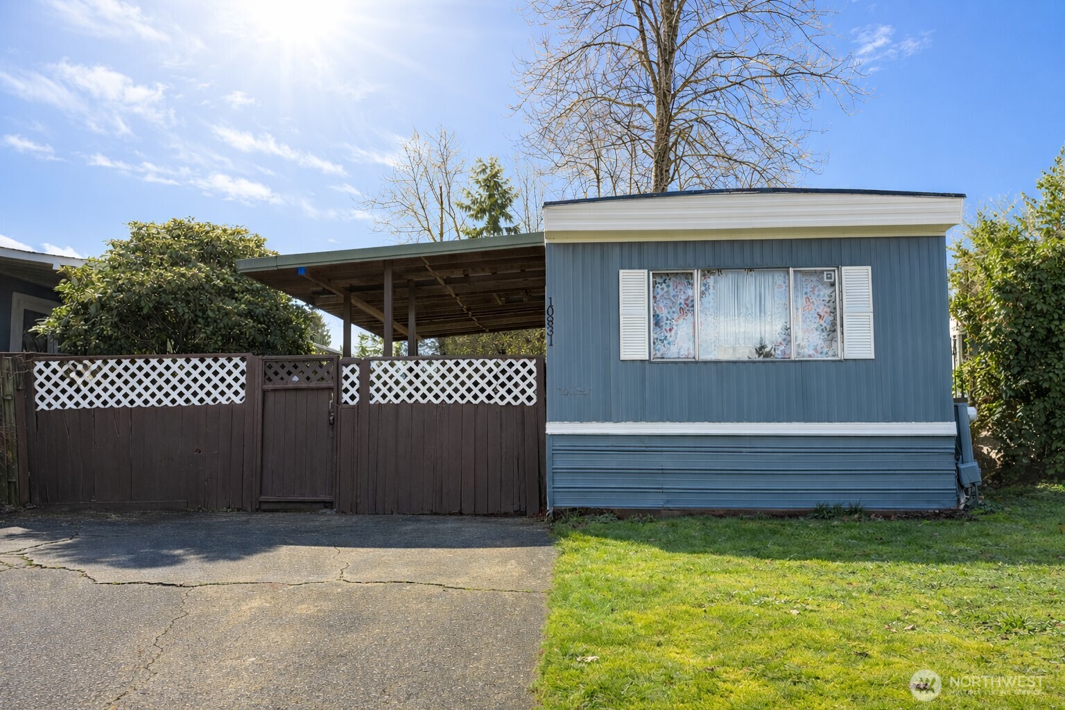 10831 Southeast 226th Street Kent, WA 98031 - Photo 1 of 17 a front view of a house with a garden