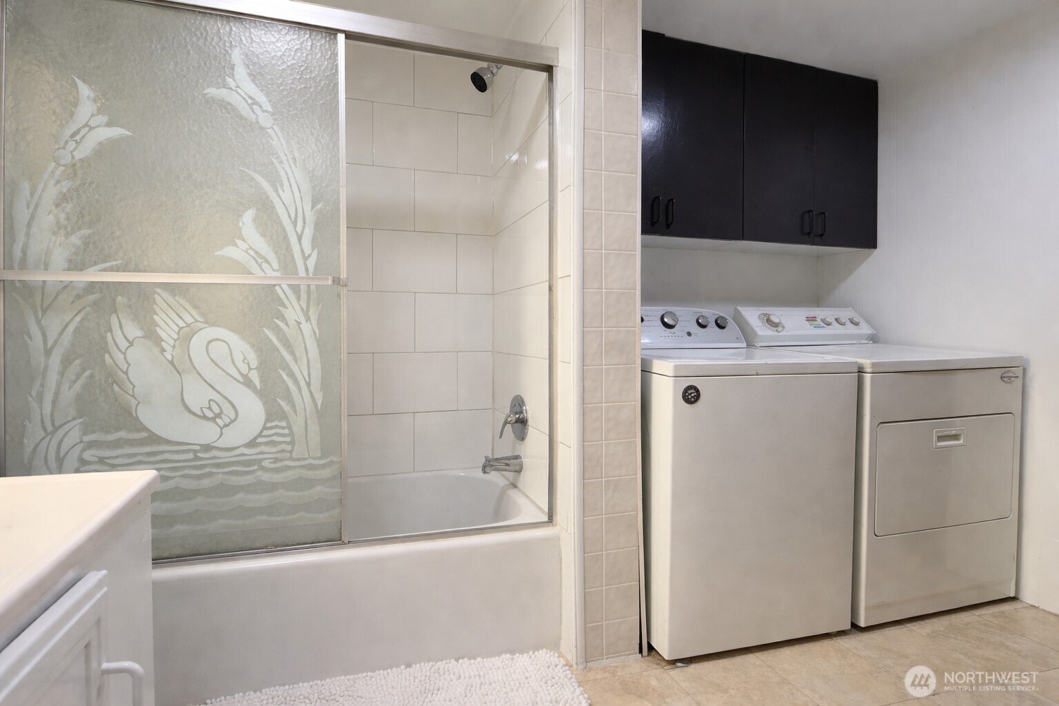 10831 Southeast 226th Street Kent, WA 98031 - Photo 11 of 17 a bathroom with a bathtub and a shower