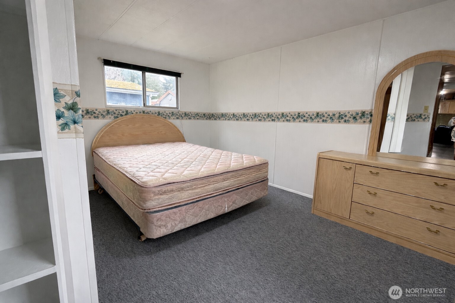 10831 Southeast 226th Street Kent, WA 98031 - Photo 13 of 17 a spacious bedroom with a bed and window