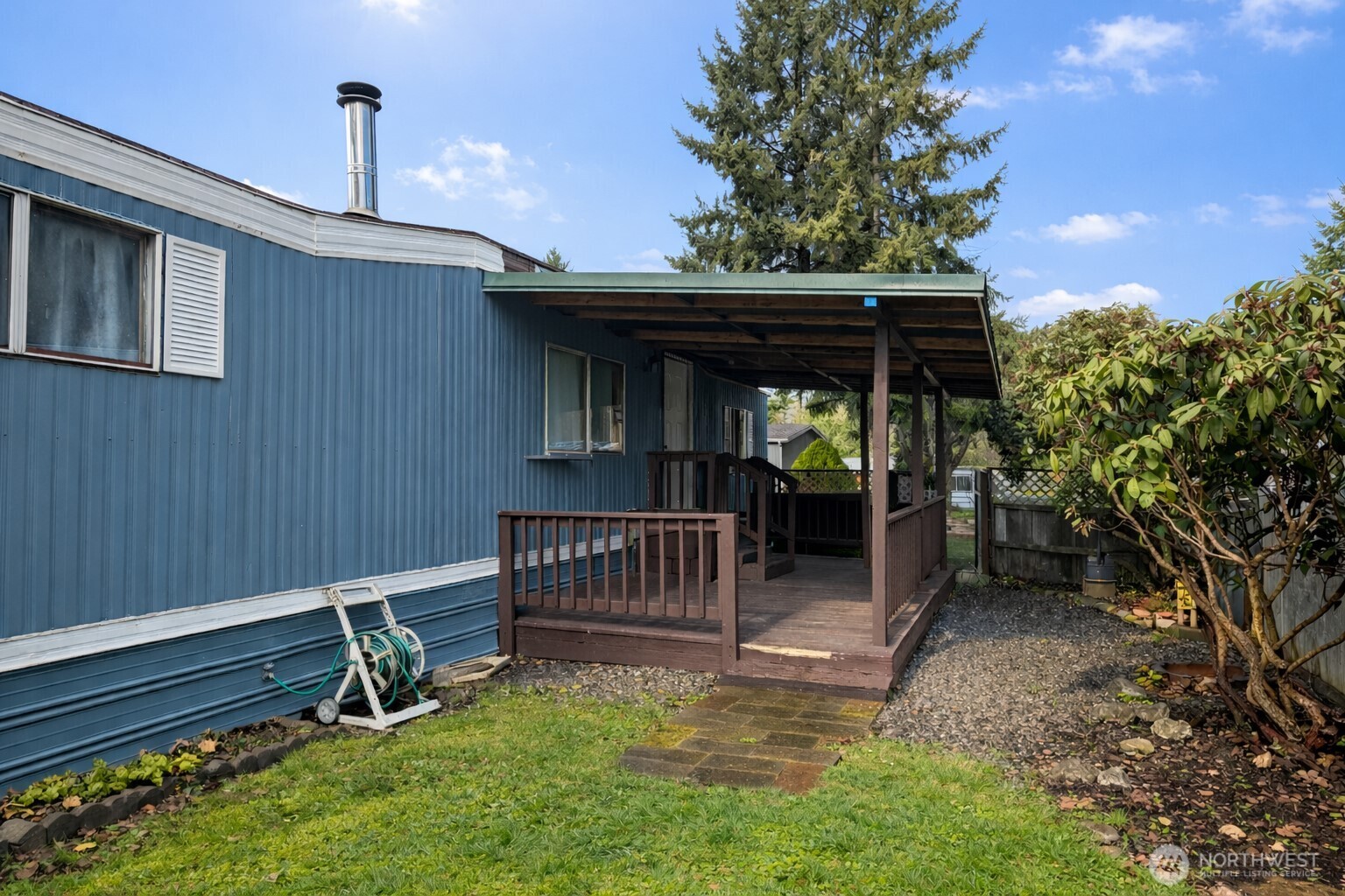 10831 Southeast 226th Street Kent, WA 98031 - Photo 15 of 17 a view of a chair and table in the backyard