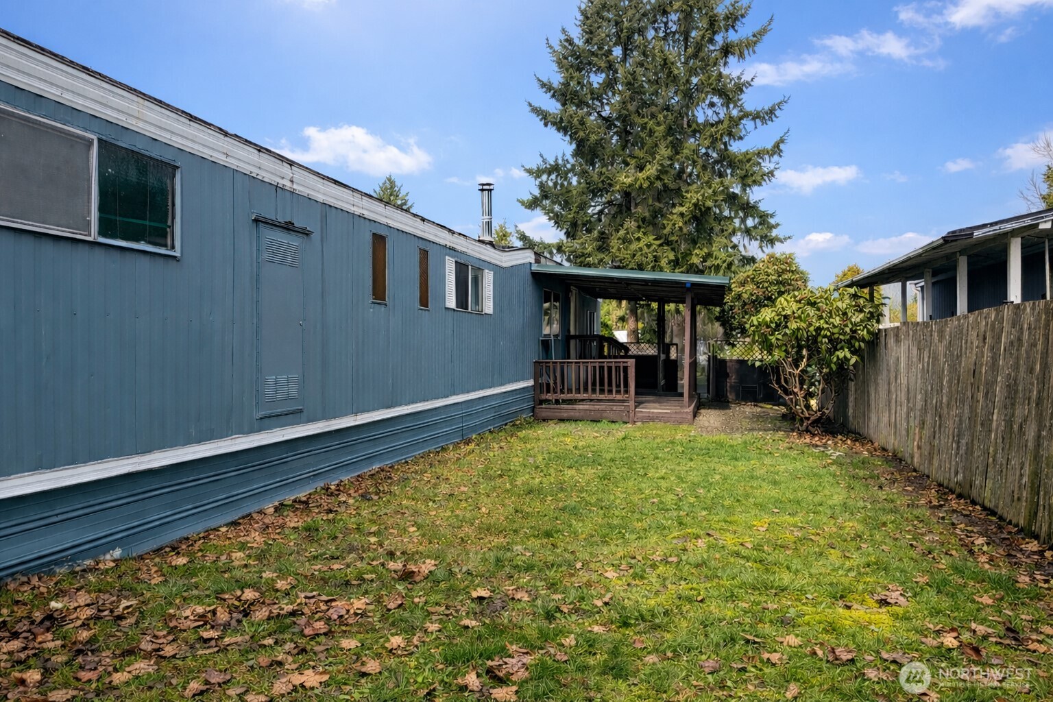 10831 Southeast 226th Street Kent, WA 98031 - Photo 16 of 17 a backyard of a house with lots of green space