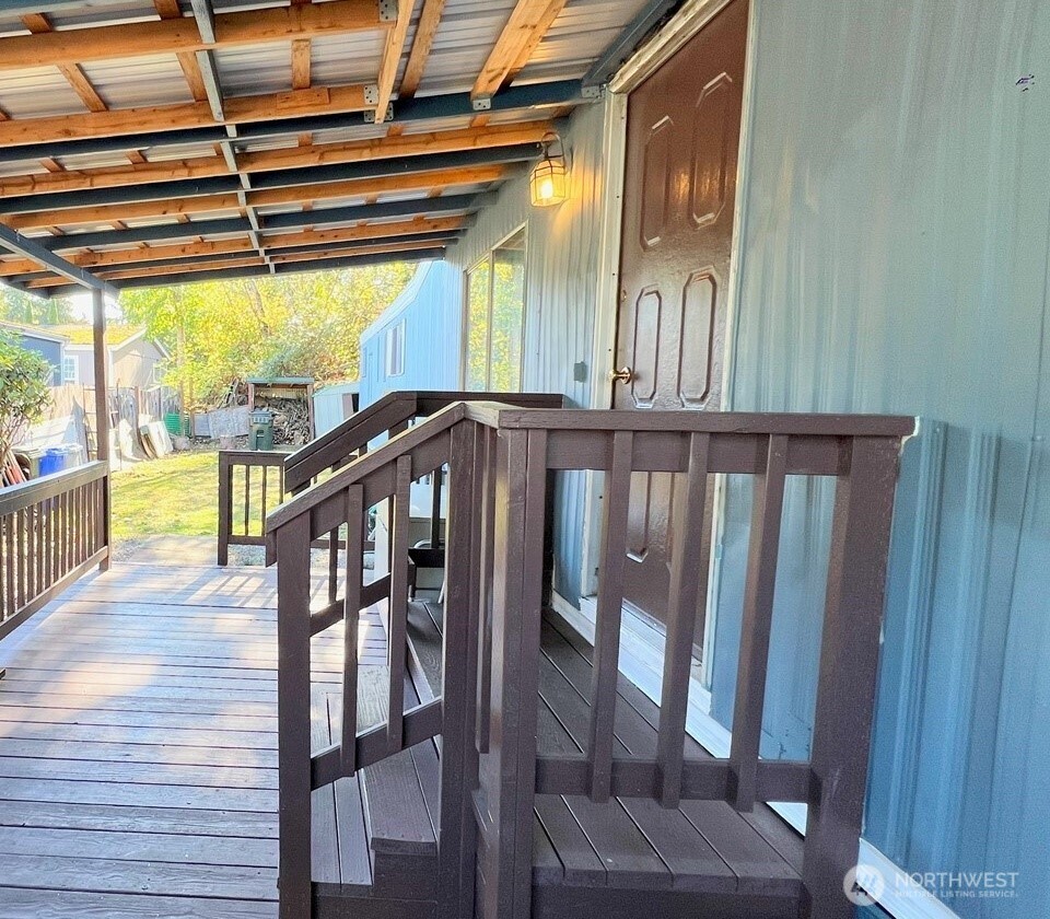 10831 Southeast 226th Street Kent, WA 98031 - Photo 2 of 17 a view of a porch with wooden floor