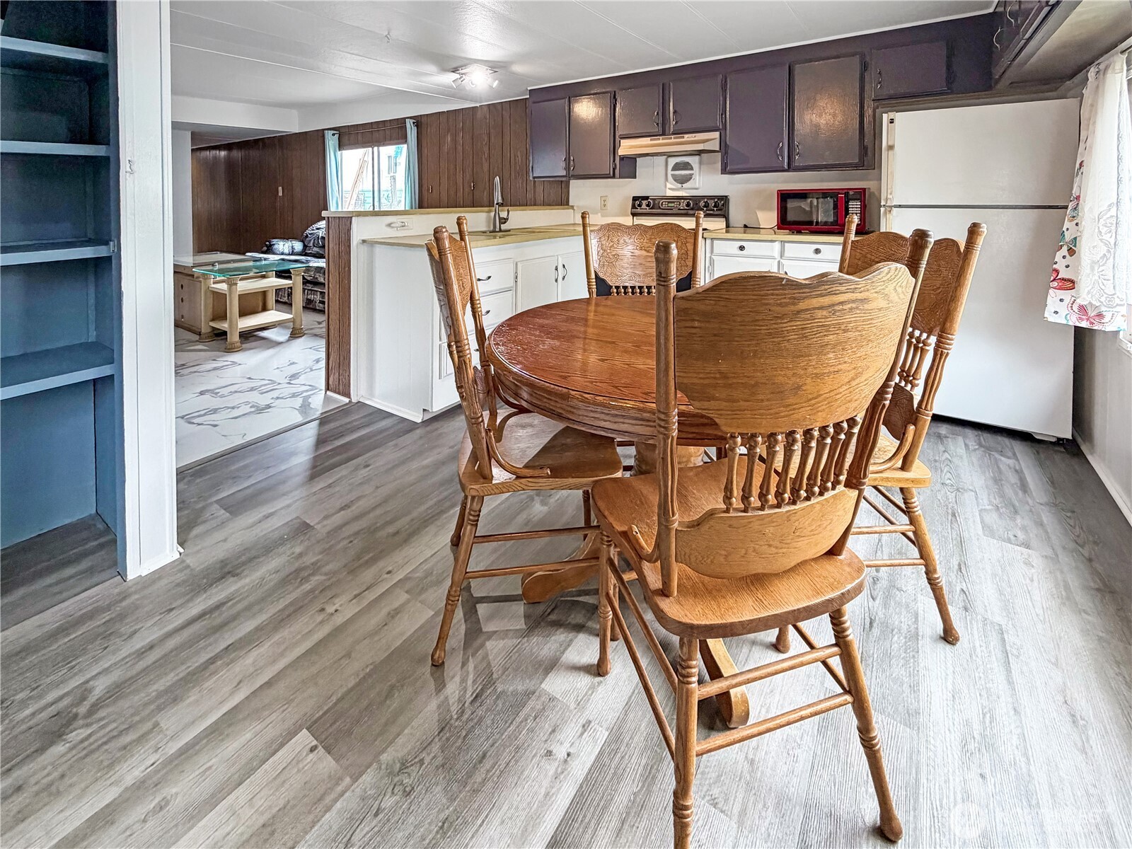 10831 Southeast 226th Street Kent, WA 98031 - Photo 5 of 17 a dining room with furniture and wooden floor
