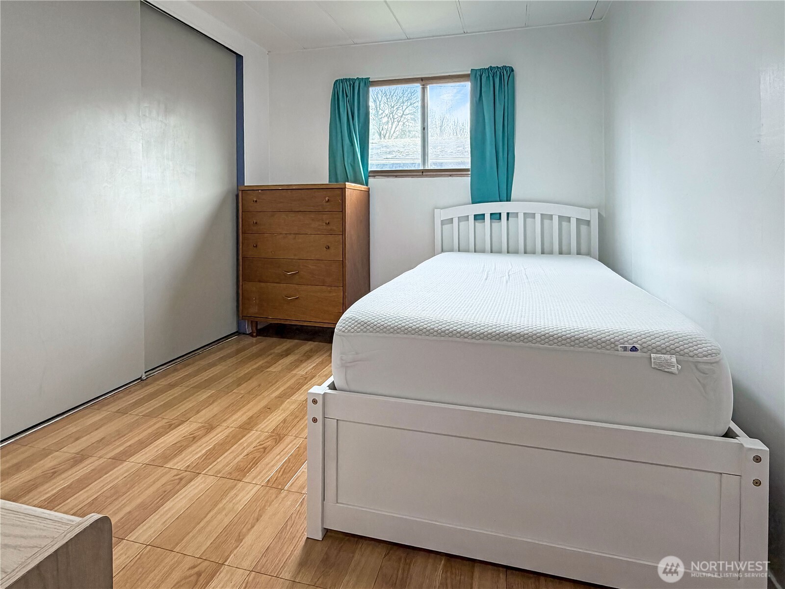 10831 Southeast 226th Street Kent, WA 98031 - Photo 9 of 17 a bedroom with a bed and a window