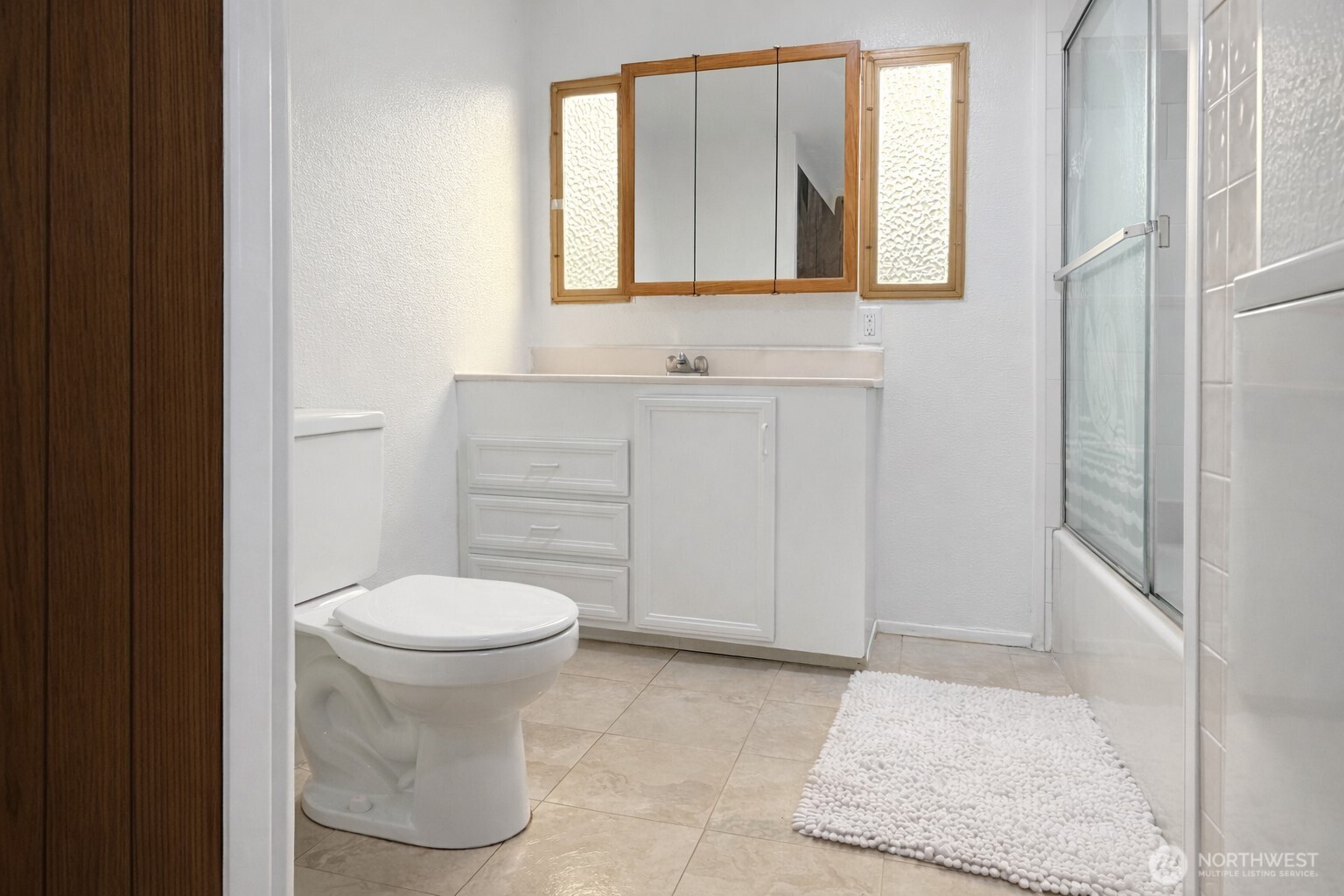 10831 Southeast 226th Street Kent, WA 98031 - Photo 10 of 17 a bathroom with a sink and a toilet